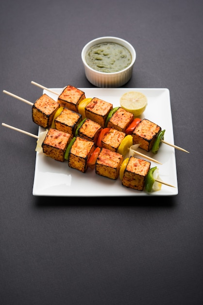 Premium Photo | Barbecue paneer tikka kabab - indian tandoori cottage ...