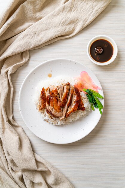 Premium Photo | Barbecue roasted duck on rice