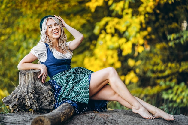 Premium Photo Barefoot Happy Pretty Blond Girl In Dirndl Traditional Beer Festival Dress Sitting Outdoors With Blured Colorful Trees Behind A community of barefoot and minimalist runners. https www freepik com profile preagreement getstarted 9088659