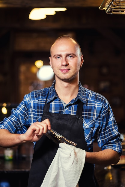 Premium Photo | Barman at work in pub,portrait of cheerful barman ...