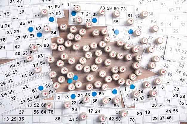 Premium Photo | Barrels with numbers and cards for lotto table game.