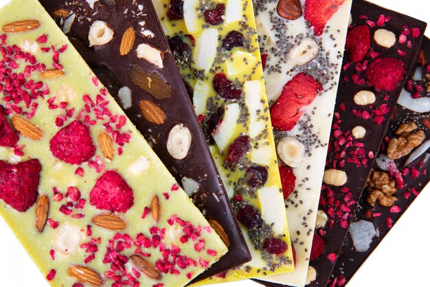 Premium Photo | Bars of multicolor chocolate with sublimated berries ...