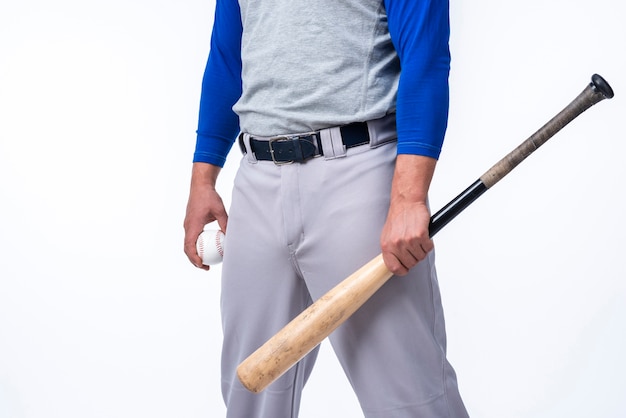 Free Photo | Baseball Player Holding Bat And Ball