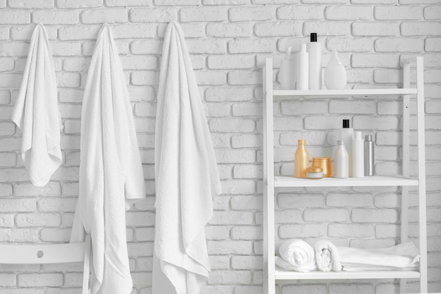 Bathroom Shelving With Cosmetic Bottles, How To Hang Shelves On Brick Wall