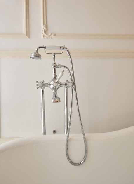 Premium Photo | Bathtub Faucet And Vintage Shower Faucet On A White ...