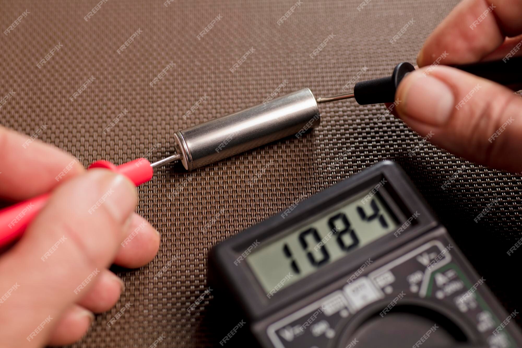 Premium Photo | Battery with volt calculator voltmeter red positive ...