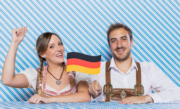 Bavarian friends holding german flag Free Photo