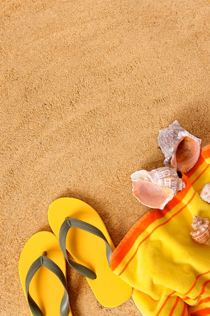 Beach background with yellow towel Photo | Free Download