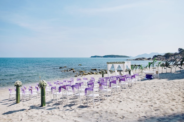 Premium Photo | Beach wedding venue settings with white chiavari chairs ...