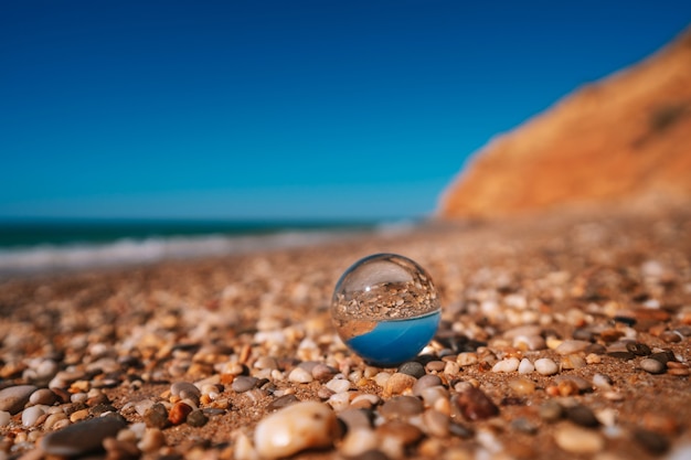 Premium Photo | Beach with sea photographed through a crystal ball in focus