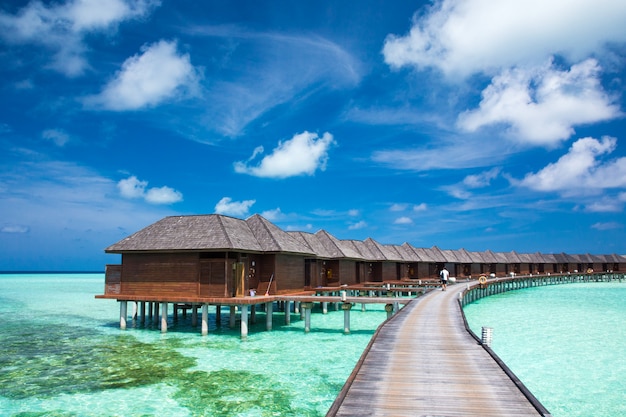 Premium Photo | Beach with water bungalows at maldives