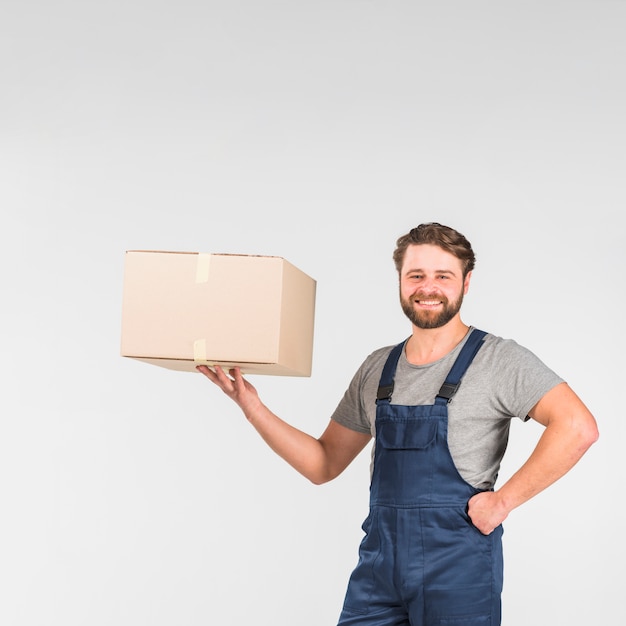 Free Photo Bearded Delivery Man Holding Box