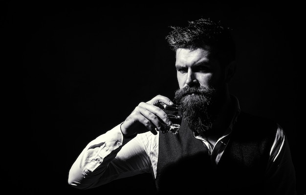 Premium Photo | Bearded drink cognac. sommelier tastes drink. man ...