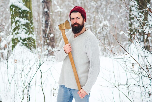 Premium Photo Bearded Man Lumberjack In Winter Snowy Forest