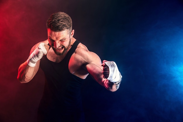 Premium Photo | Bearded tattooed portsman muay thai boxer in black ...