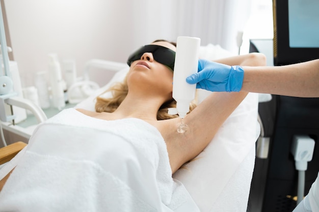 Laser Hair Removal In A Tube Reviews Premium Photo | Beautician squeezes out laser hair removal gel from a tube