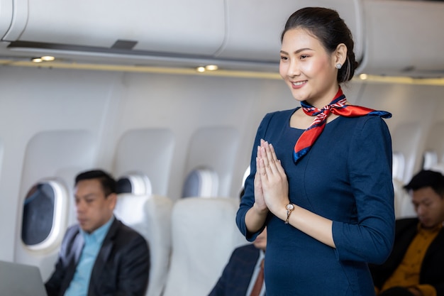 Premium Photo | Beautiful air hostess in an airplane smiling, portrait ...