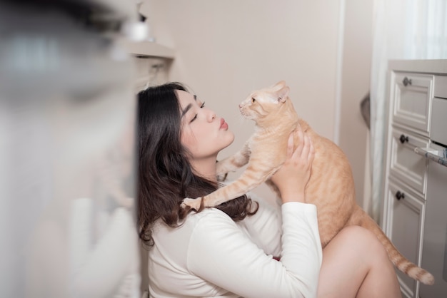 Premium Photo Beautiful Asian Cat Lover Woman Is Playing With Cat In Her Room