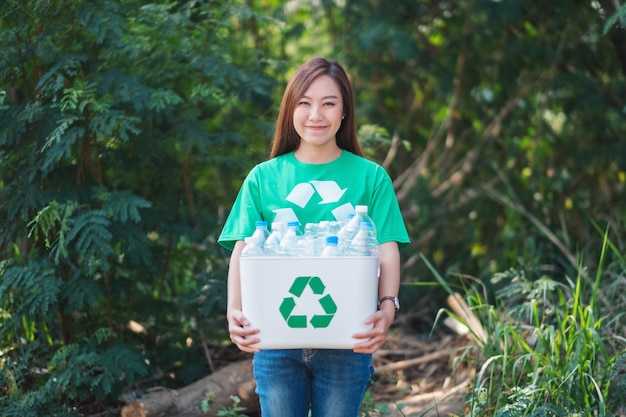 Premium Photo | A beautiful asian woman collecting garbage and holding ...