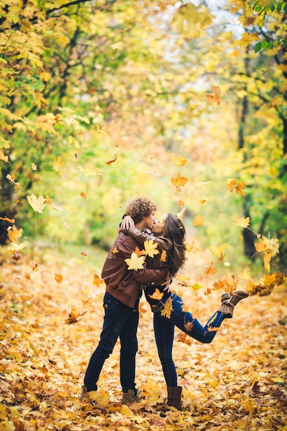 Premium Photo Beautiful Autumn Alley Of Maples Loving Couple Kisses