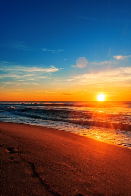 Free Photo Beautiful Beach Sunrise Under A Blue Sky