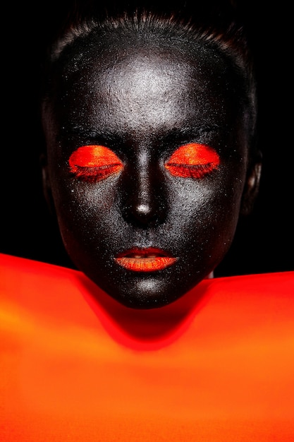 Free Photo | Beautiful black woman in black mask with orange bright ...
