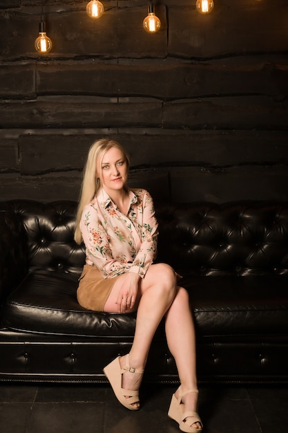 Beautiful Blonde In A Mini Skirt, Mini Leather Sofa