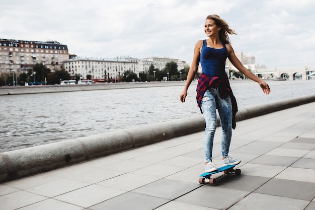 Free Photo | Beautiful blonde skateboard on the promenade