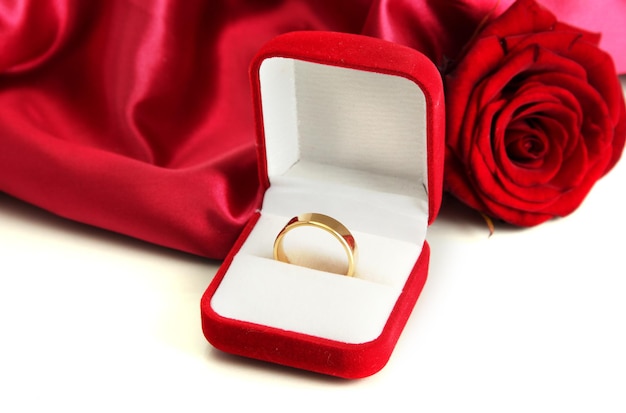 Premium Photo | Beautiful box with wedding ring and rose on red silk ...