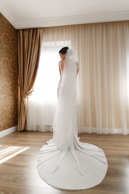 Beautiful Bride In Chic Long Dress Indoor In Hotel Room