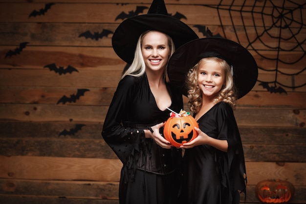 Premium Photo | Beautiful caucasian mother and her daughter in witch ...