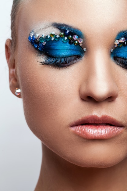 Beautiful caucasian woman with artistic makeup Free Photo