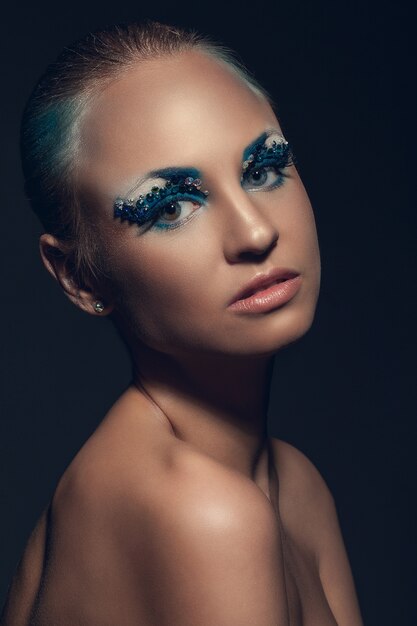 Beautiful caucasian woman with artistic makeup Free Photo