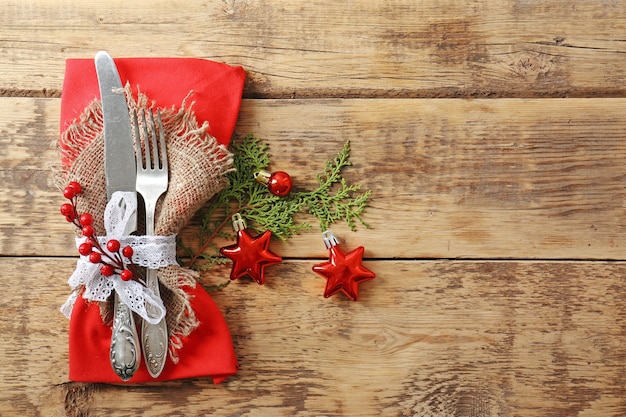 Premium Photo | Beautiful christmas table setting on wooden background
