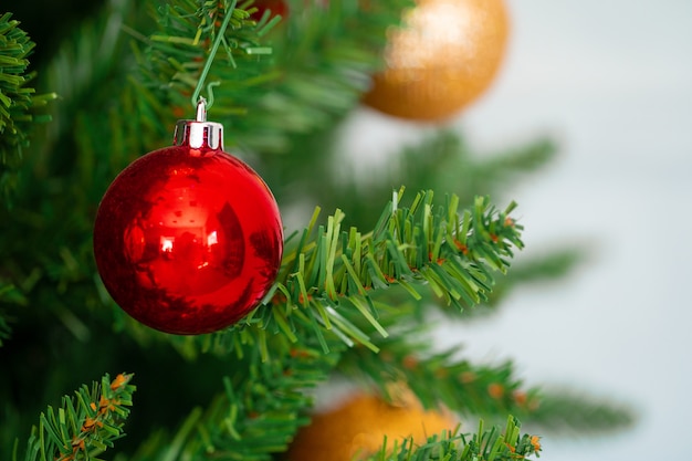 Premium Photo | Beautiful christmas tree with red baubles close up