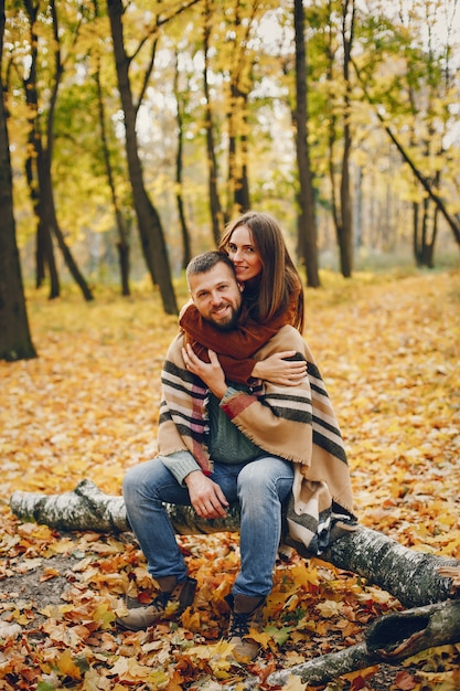 Free Photo | Beautiful couple spend time in a autumn park