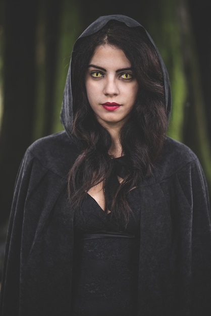 Premium Photo | Beautiful dark vampire woman with black mantle and hood