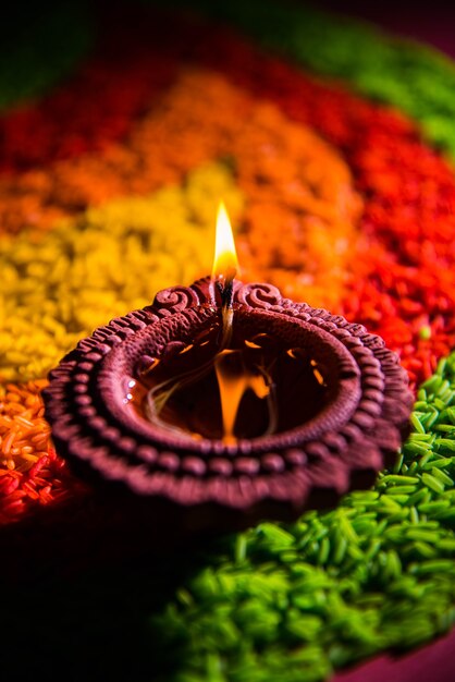 Premium Photo | Beautiful diwali greeting using diya or clay oil lamp ...