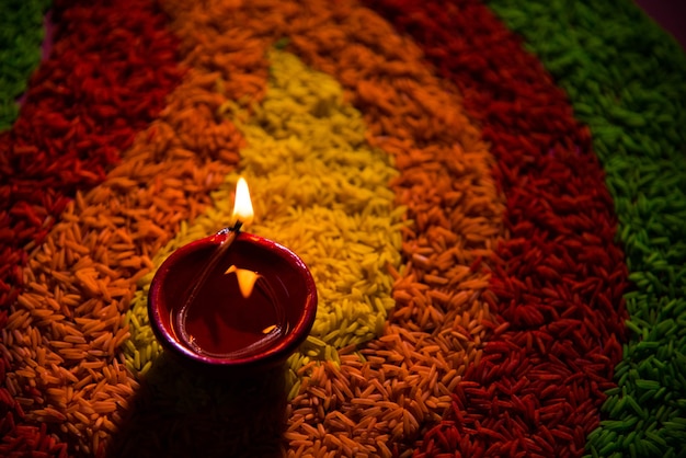 Premium Photo | Beautiful diwali greeting using diya or clay oil lamp ...