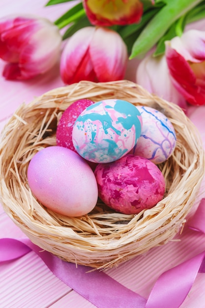 Premium Photo | Beautiful easter composition with decorated eggs and ...