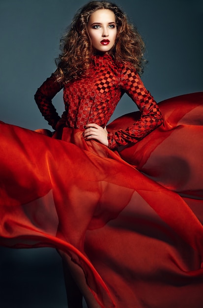 Free Photo | Beautiful elegant woman in bright red dress