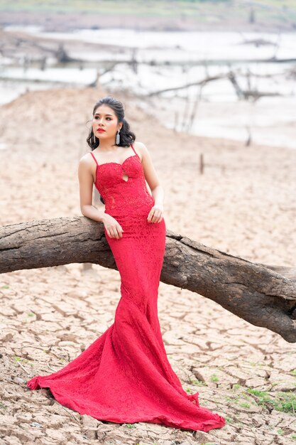 Premium Photo | Beautiful fashion woman in autumn red dress