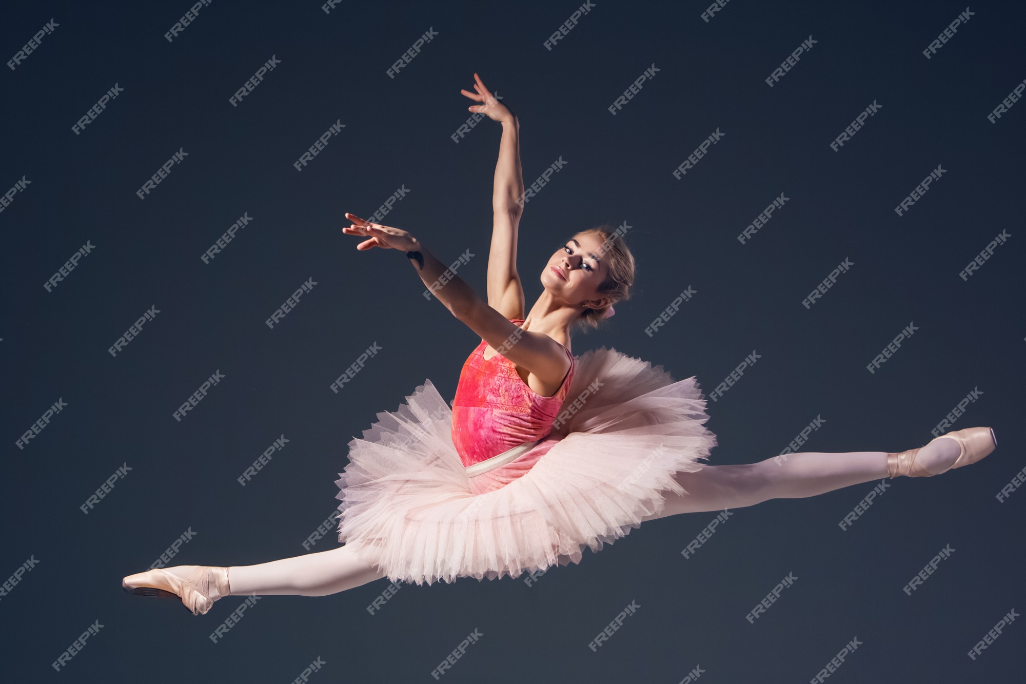 Free Photo | Beautiful female ballet dancer on a grey background
