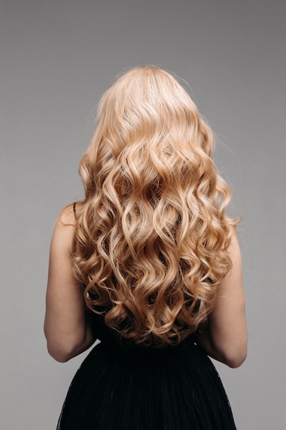 Beautiful Female Curly Blond Hairs Back View Premium Photo