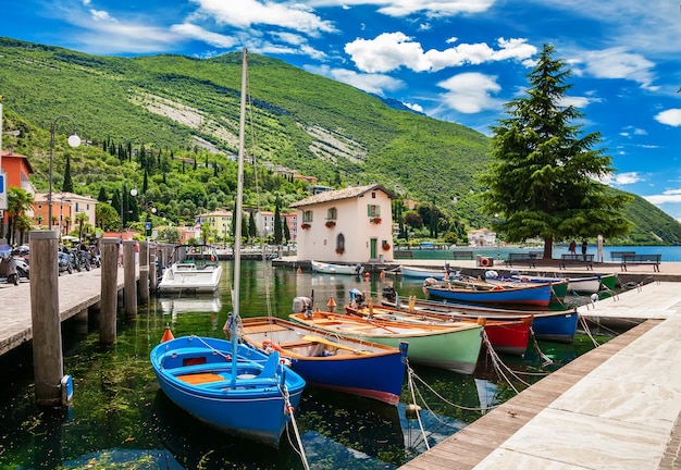 Premium Photo | Beautiful fishing harbor with colorful boats in nago ...