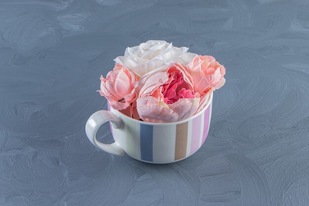 Free Photo | Beautiful flowers in a cup , on the white background. high