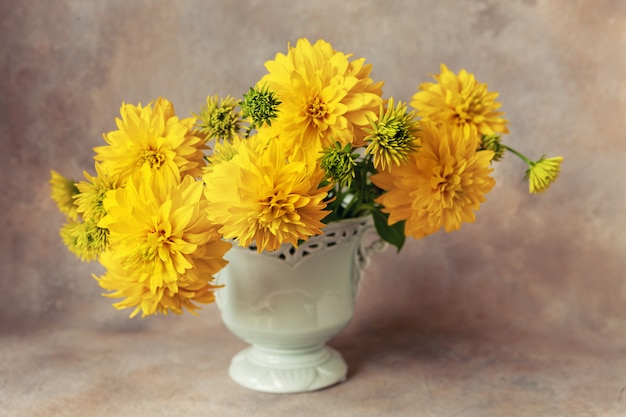 Premium Photo Beautiful Fresh Bouquet Of Yellow Rudbeckia Gold Balls In Light Blue Vase