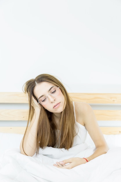 Premium Photo | Beautiful girl boring pose on bed after wakeup morning time