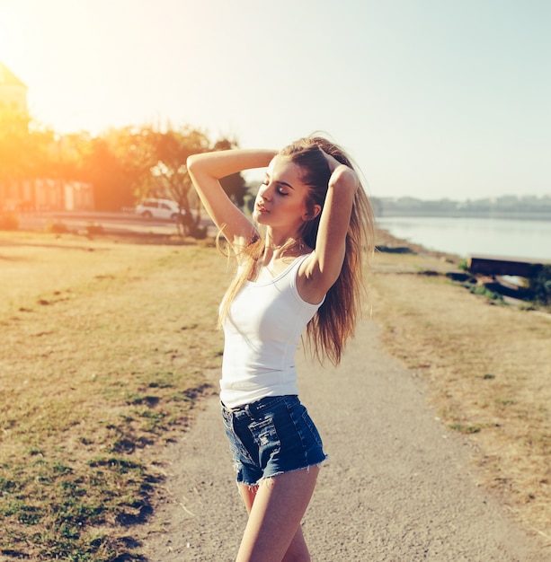 Beautiful girl enjoying a sunny day | Free Photo