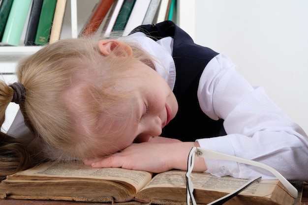 Premium Photo Beautiful Girl Fell Asleep At The Table With Books